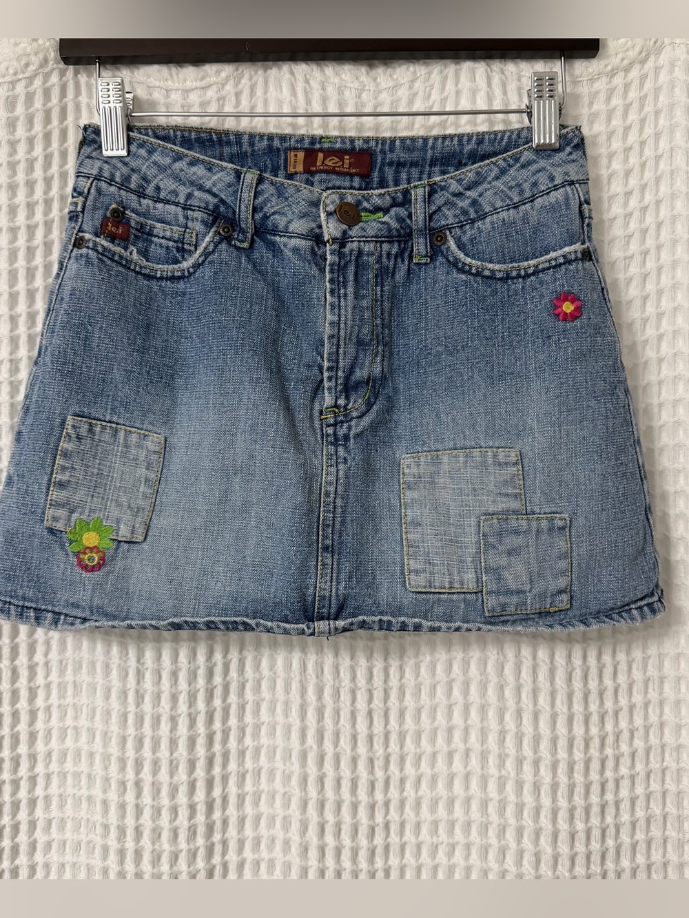 lei Light Blue Denim Mini Skort with Floral Patch Accents